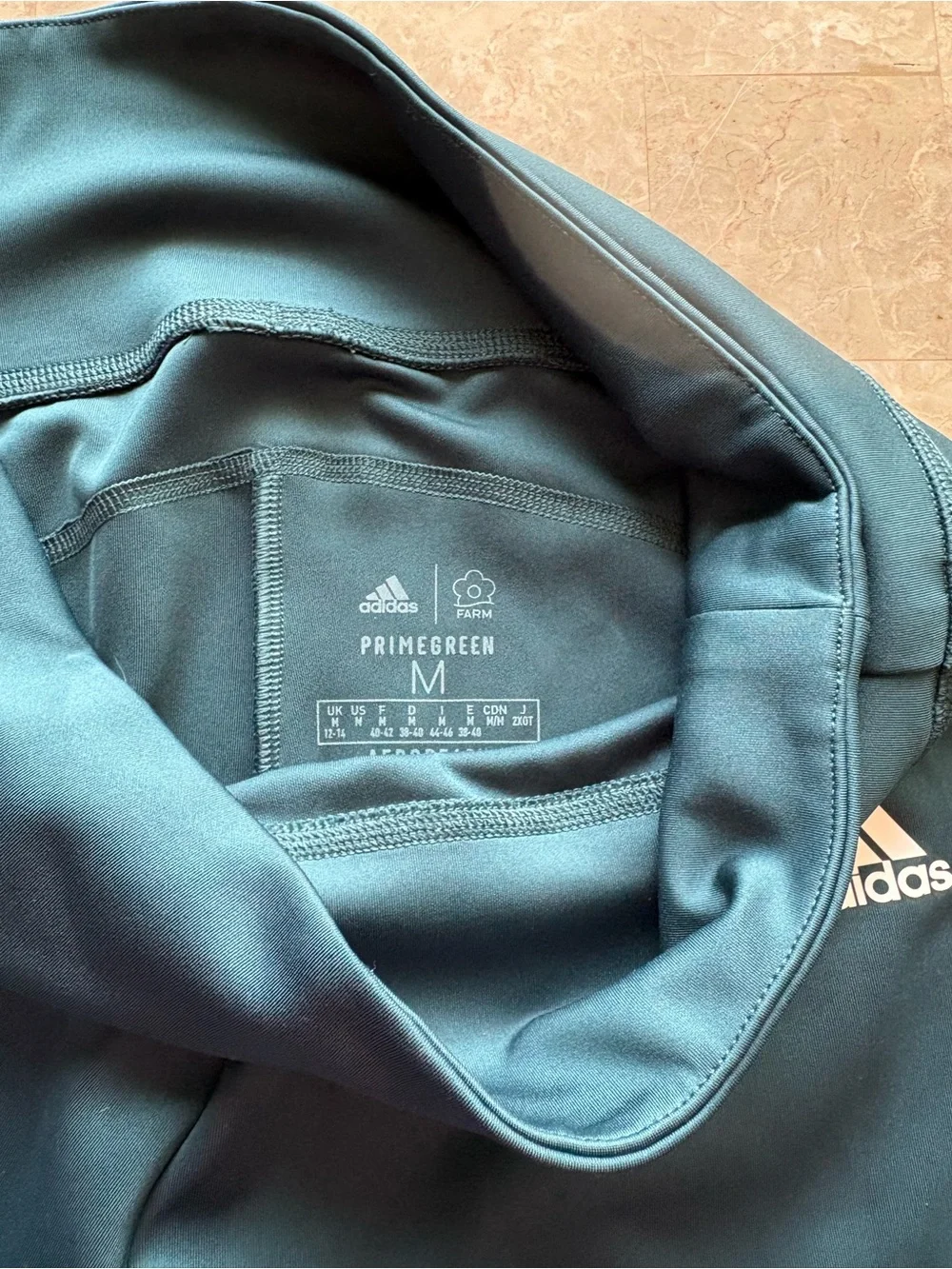 1 adidas, 2 Calvin Kline, 1 Sketchers Teal and Black Leggings-lot of 5 in size M